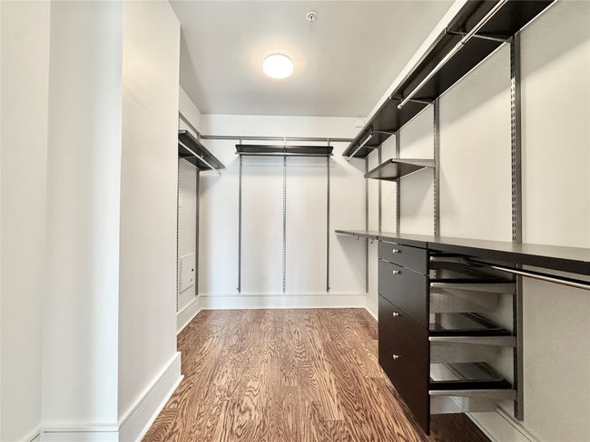 Spacious closet featuring wood finished floors | Image 20