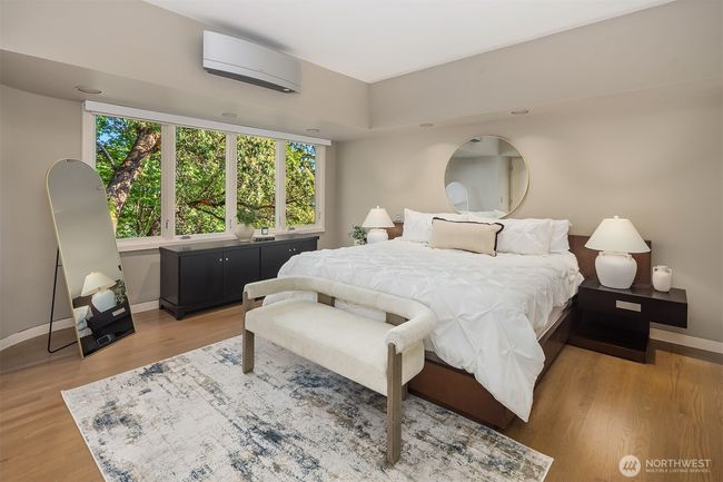 The primary suite is sizable and enjoys privacy away from the living/entertaining spaces: a serene natural view. Watch birds from your own private sanctuary. | Image 21