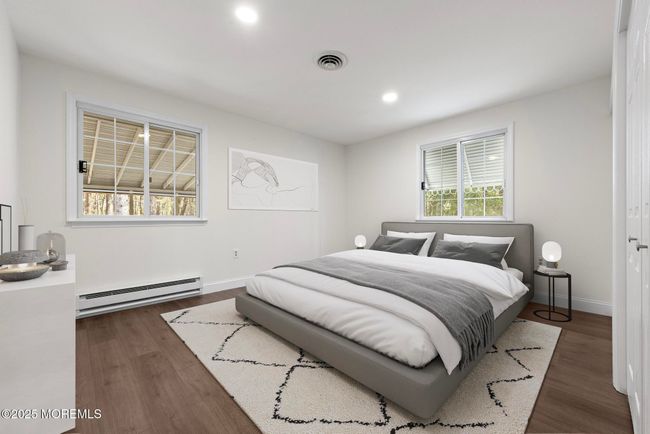 Large guest bedroom with ample closet space | Image 18