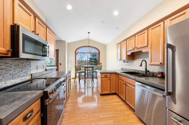 Eat-in kitchen with breakfast nook/dining space with walkout to the deck. | Image 15