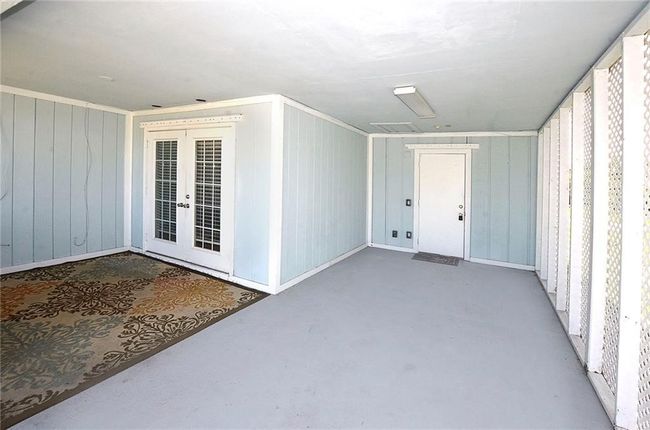 Carport Area with French Doors/ Laundry behind Single Door | Image 4