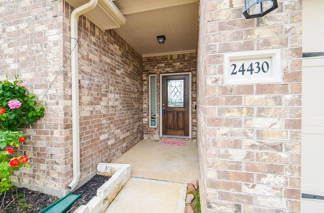 Artisan like brick elevation lines the spacious covered front entrance. | Image 4
