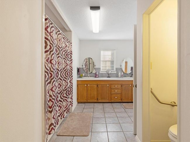 ...Whirlpool tub & shower plus large linen closet | Image 16