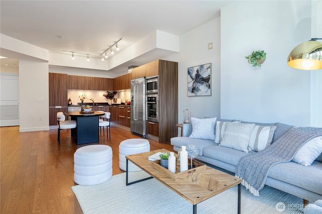 Gleaming, timeless hardwood floors add warmth and elegance throughout the home. | Image 5