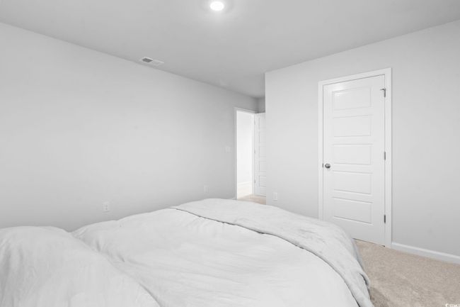 Carpeted bedroom with baseboards | Image 11