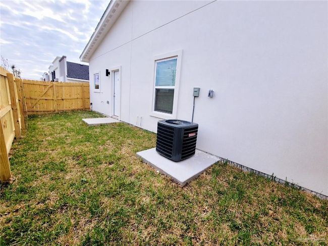 View of yard with a fenced backyard and central AC | Image 21
