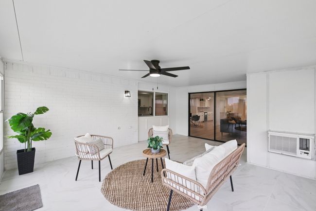View of patio / terrace with a ceiling fan, an outdoor living space, and a wall mounted air conditioner | Image 30