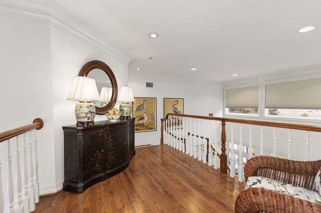 Upstairs landing with beautiful hardwoods and windows overlooking back yard | Image 22