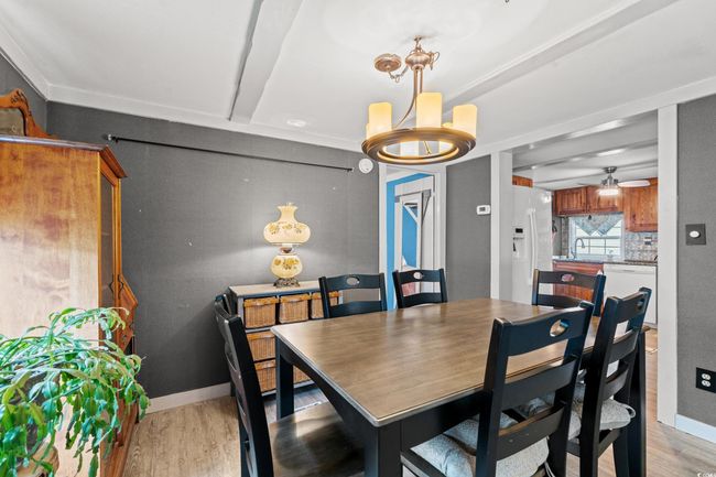 Dining space with ceiling fan, beam ceiling, and light hardwood / wood-style flooring | Image 9