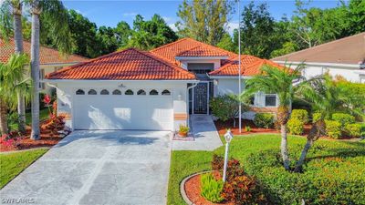 Mediterranean / spanish-style house with a garage | Image 1