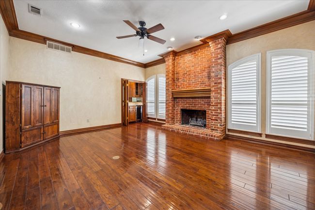 Spacious living area with wetbar for entertaining. | Image 10