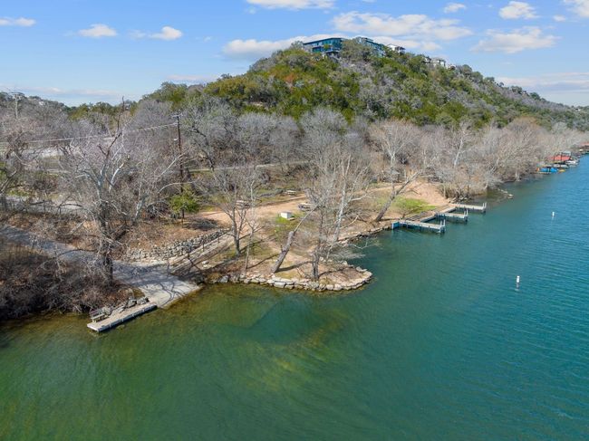 View of the homeowner's waterfront park with boat launch and day docks on Lake Austin | Image 28