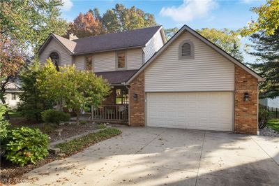 View of property with a garage | Image 3