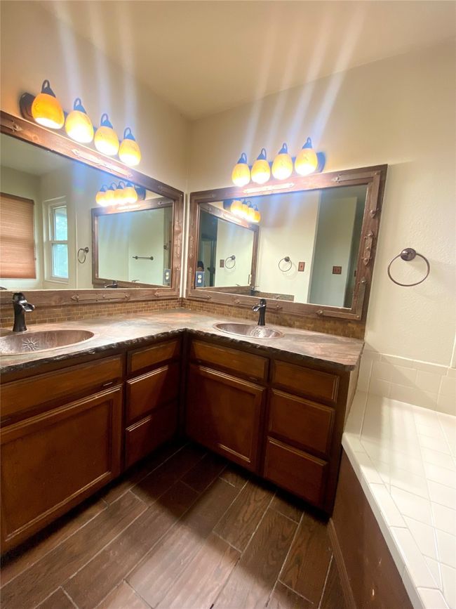 Bathroom featuring double vanities, separate shower and tub | Image 14