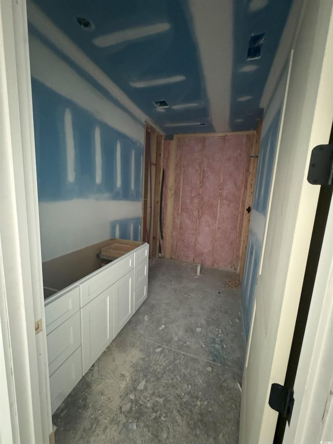 Bathroom featuring unfinished concrete floors | Image 25