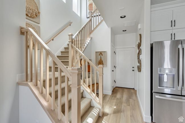 Stairway with wood finished floors and baseboards | Image 24
