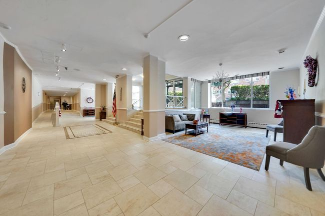 Common area with stairs and recessed lighting | Image 15
