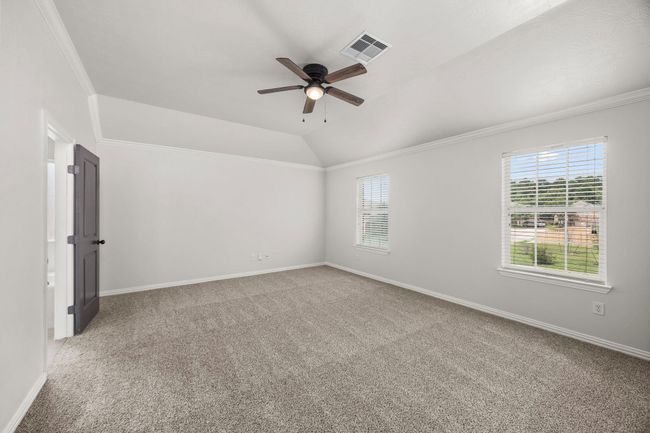 Spacious Primary Bedroom with Raised Ceilings | Image 21