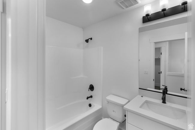 (Picture of Previously Build Home) Main Bath featuring White Cabinets & Quartz Countertops. Tile Floors | Image 8