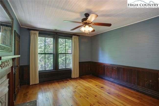 Additional guest bedroom with non-working coal fireplace | Image 32