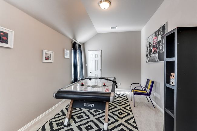 Game room featuring light colored carpet and lofted ceiling | Image 37