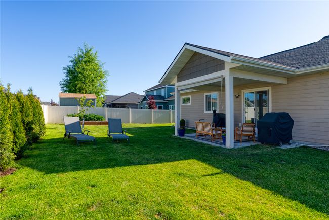 View of yard with a patio and outdoor lounge area | Image 31