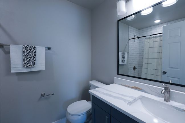 Full bathroom featuring vanity and a shower with shower curtain | Image 17
