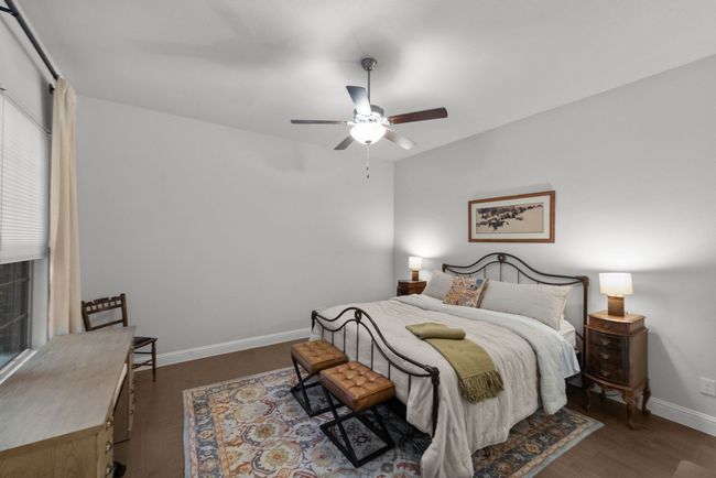 Secondary bedroom featuring wood flooring, and ceiling fan | Image 28