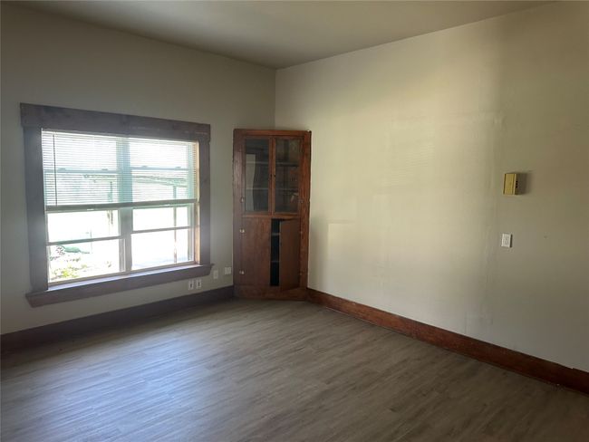 Empty room with baseboards and wood finished floors | Image 15