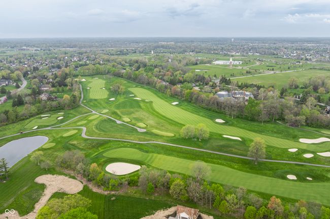 aerial view with a water view and view of golf course | Image 80