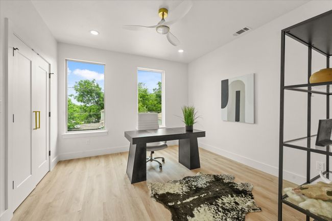 Office space with ceiling fan, baseboards, light wood-style flooring, and recessed lighting | Image 12