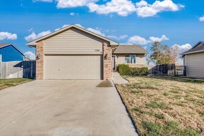 Single story home with a garage and a front yard | Image 2