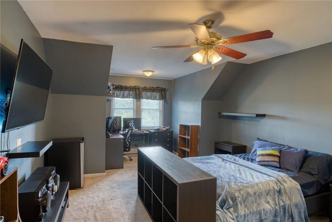 Carpeted bedroom featuring ceiling fan | Image 27