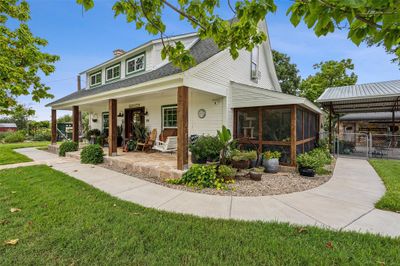 Notice the screened-in side porch. Located on the east side of the home insures maximum shade. | Image 2