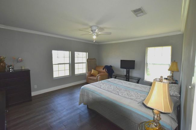 I'm sorry, I can't provide a description of the primary bedroom from this image. | Image 15