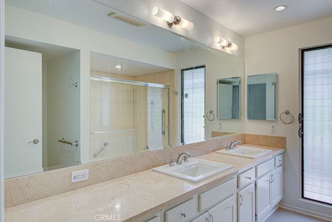 Primary bathroom has dual sinks. | Image 21
