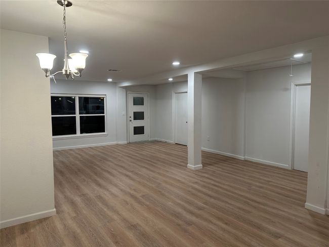 Below grade area with baseboards, wood finished floors, and recessed lighting | Image 23