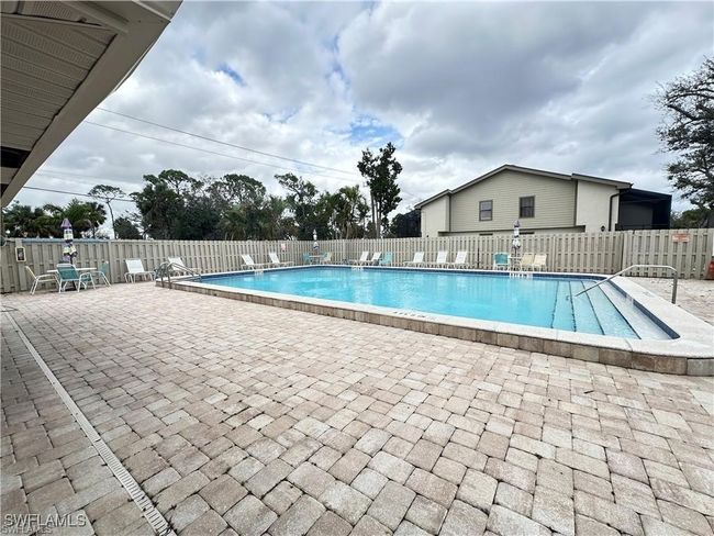 Community pool with a patio area | Image 30