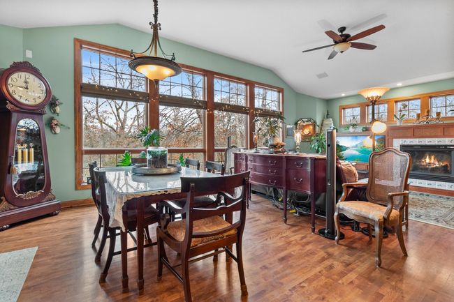 Breakfast area open to family room. Floor-to-ceiling windows overlooking back yard. | Image 10