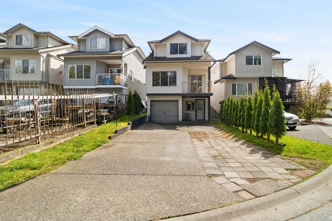 View of front of house featuring an attached garage and driveway | Image 32