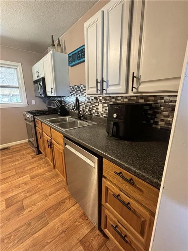 Kitchen featuring appliances with stainless steel finishe | Image 7