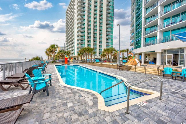 Pool featuring a patio area | Image 23