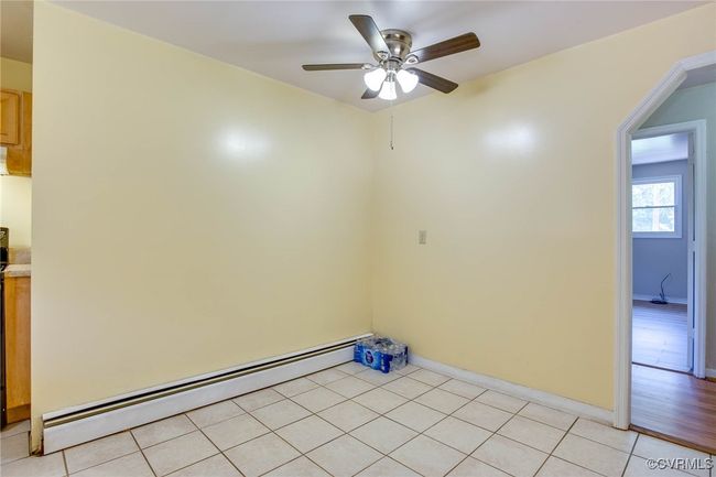 Dining area with baseboard heating, ceiling fan, and light hardwood / wood-style floors | Image 20
