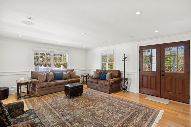 Living room featuring ornamental molding and hardwood / wood-style flooring | Image 12
