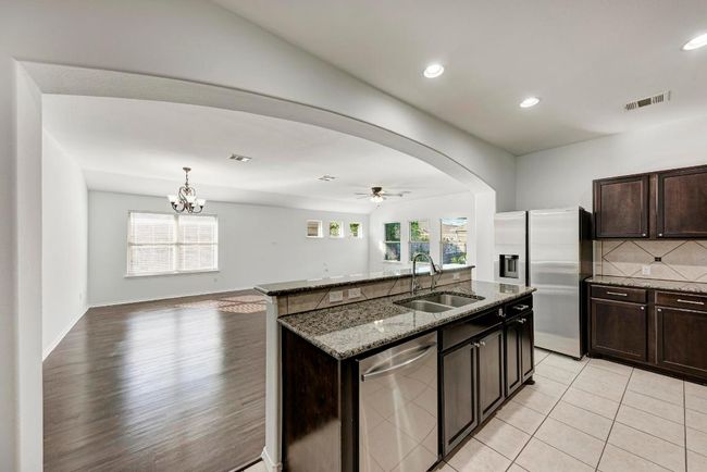 open concept kitchen and living area | Image 18