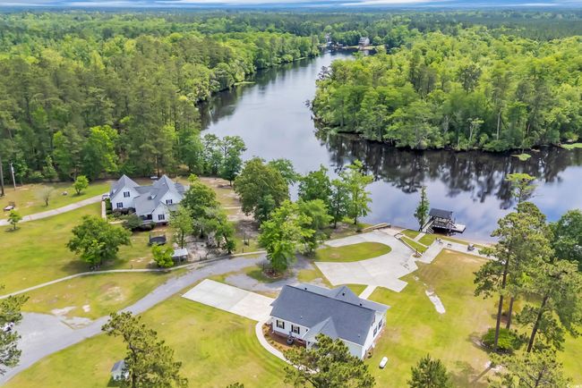 Bird's eye view of a heavily wooded area and a large body of water | Image 27