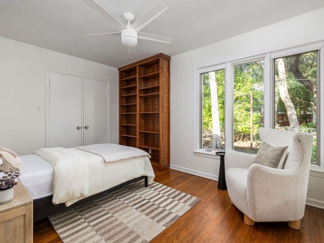 Bedroom with a closet, wood flooring, and a ceiling fan | Image 22