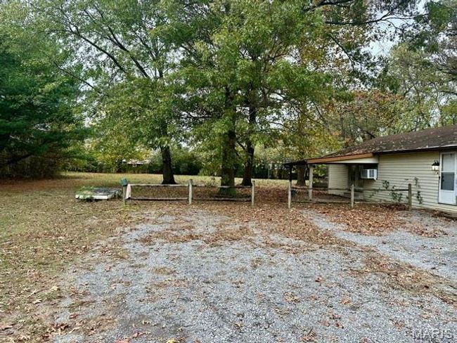 View of yard featuring a wall mounted AC | Image 8