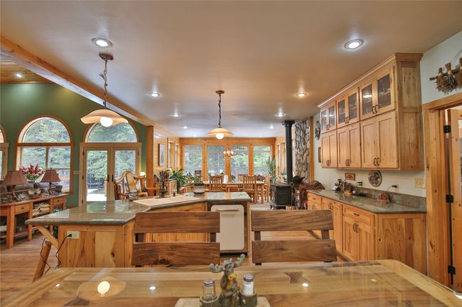 Kitchen featuring plenty of natural light, french doors, and a kitchen island | Image 8