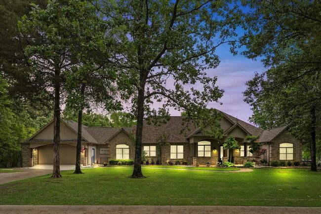 View of front facade featuring a garage and a lawn | Image 5